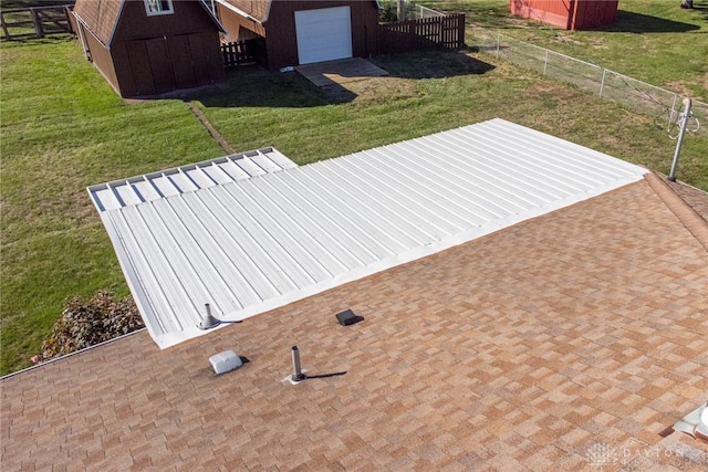 exterior space featuring a shed and a garage