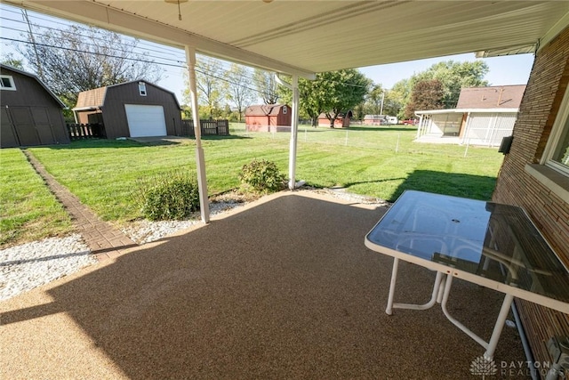 view of yard featuring an outbuilding and a garage