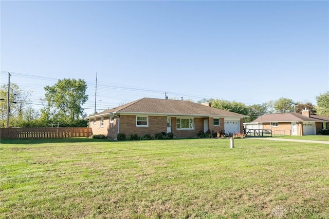 single story home with a garage and a front yard