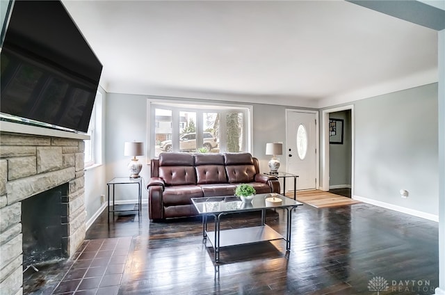 living room featuring a fireplace and dark hardwood / wood-style flooring