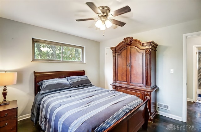 bedroom with ceiling fan and dark hardwood / wood-style flooring