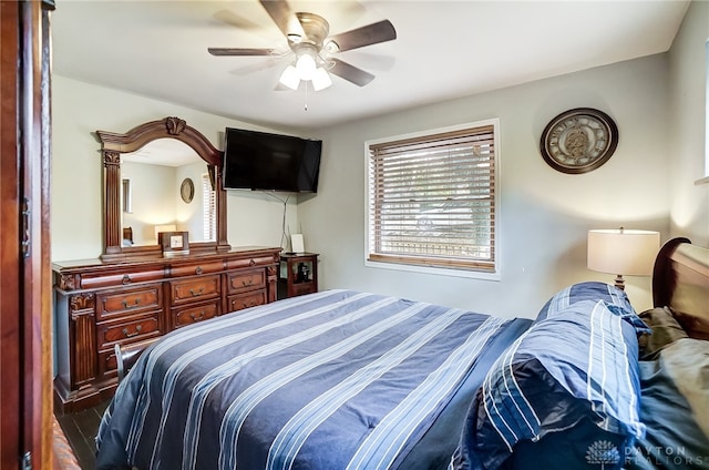 bedroom featuring dark hardwood / wood-style flooring and ceiling fan