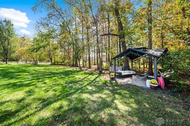 view of yard with a gazebo, a patio, and an outdoor hangout area