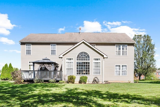 back of property featuring a gazebo, a yard, and a wooden deck