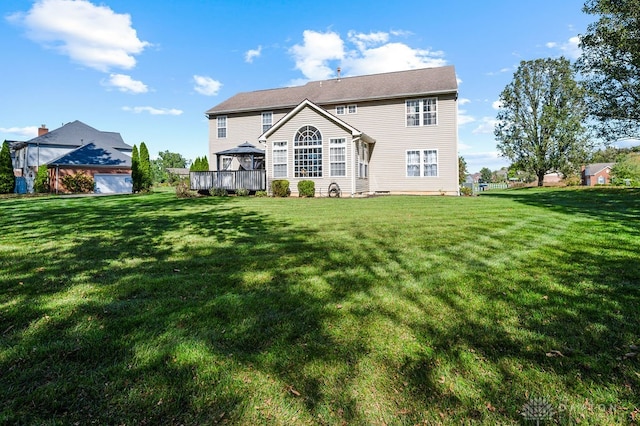 back of property featuring a lawn