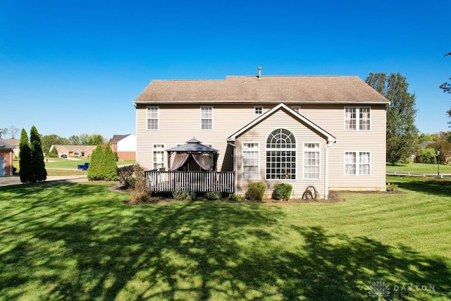 back of house featuring a yard