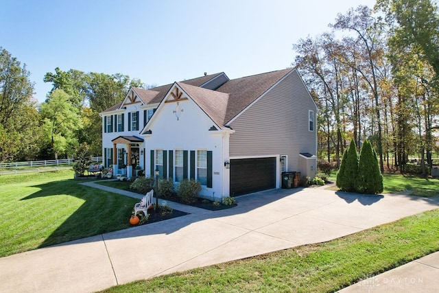 view of front facade with a front yard and a garage