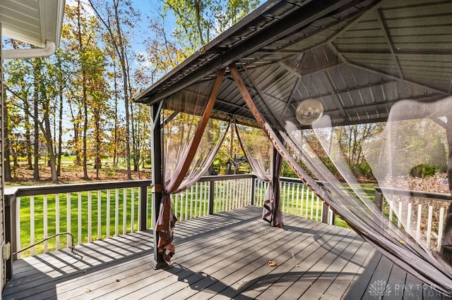 deck with a gazebo and a yard