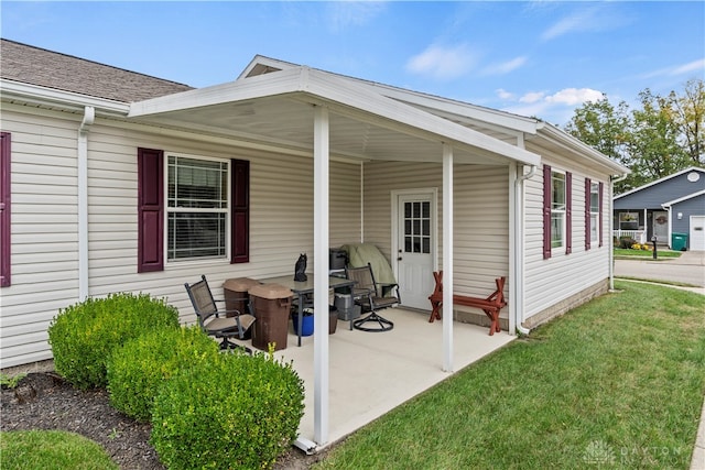 rear view of property with a yard