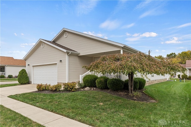 view of front of house with a front lawn and a garage