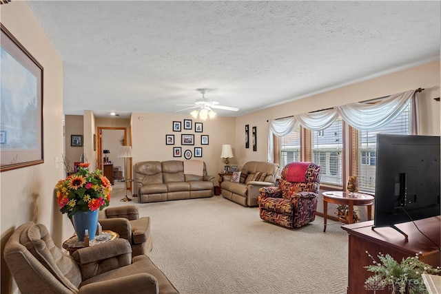 carpeted living room featuring a textured ceiling and ceiling fan