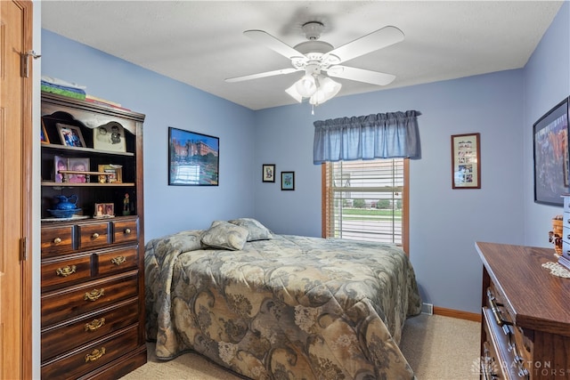 bedroom featuring ceiling fan and carpet floors