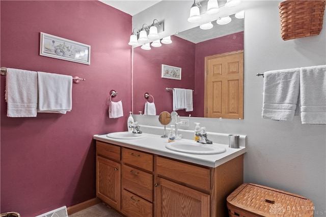 bathroom with tile patterned flooring and vanity