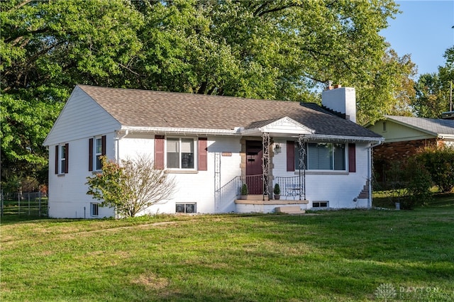 view of front of home with a front lawn