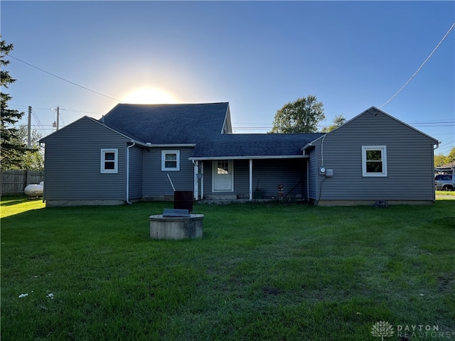 rear view of house with a lawn