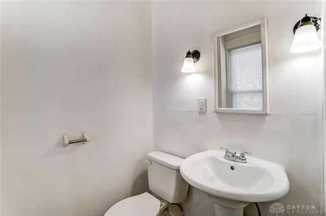 bathroom with sink and toilet