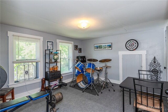 game room with carpet floors and a wealth of natural light