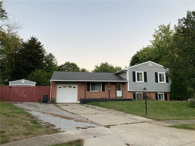 view of front facade featuring a yard and a garage