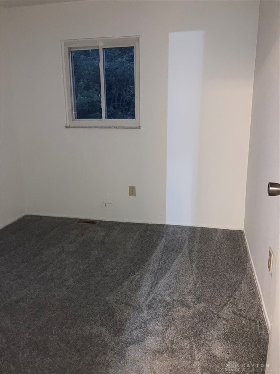 empty room with carpet flooring