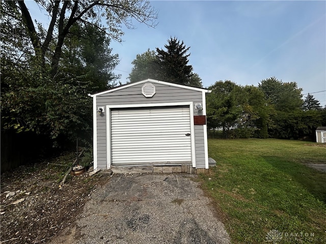 garage with a yard