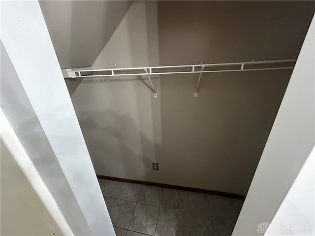 spacious closet featuring tile patterned flooring