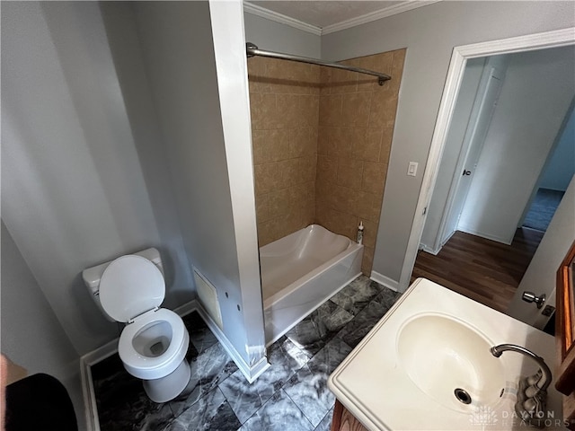 full bathroom featuring toilet, wood-type flooring, ornamental molding, tiled shower / bath, and vanity