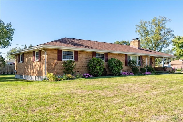 ranch-style house featuring a front lawn