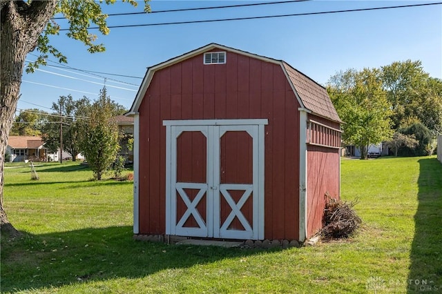 view of outdoor structure with a yard