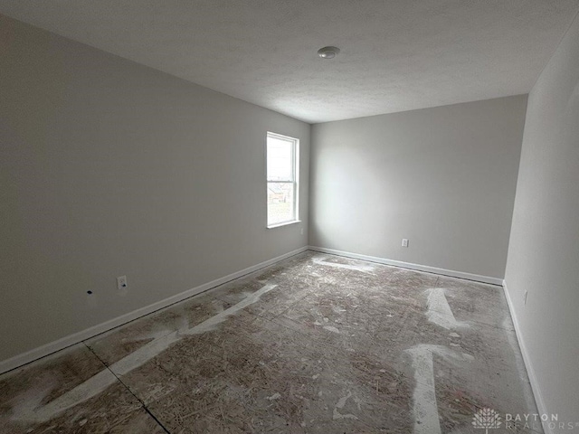 empty room featuring a textured ceiling