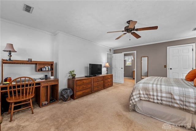 carpeted bedroom with ceiling fan and crown molding