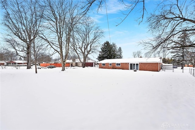 view of yard layered in snow