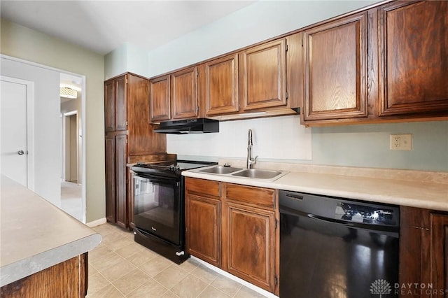 kitchen with black appliances and sink