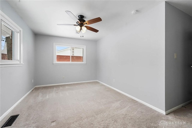 carpeted empty room with ceiling fan