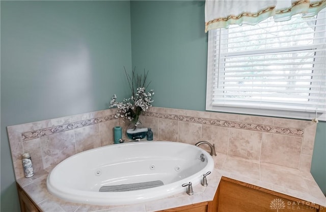 bathroom featuring tiled tub