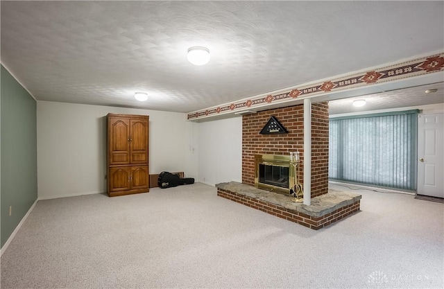 unfurnished living room featuring a fireplace, carpet floors, and a textured ceiling