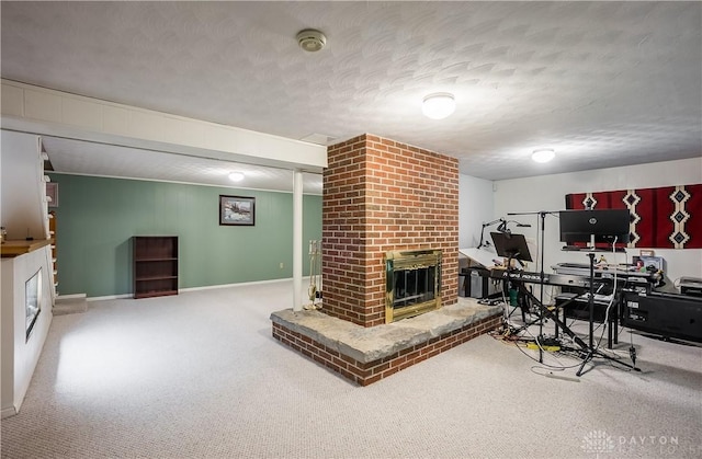 living room featuring a fireplace, baseboards, carpet floors, and a textured ceiling