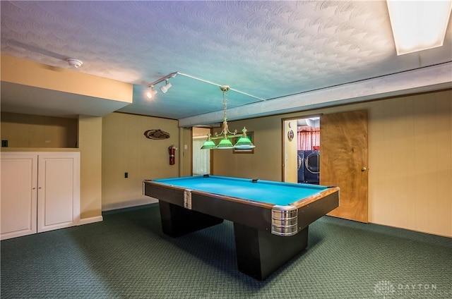 playroom featuring pool table, rail lighting, a textured ceiling, washing machine and dryer, and dark carpet