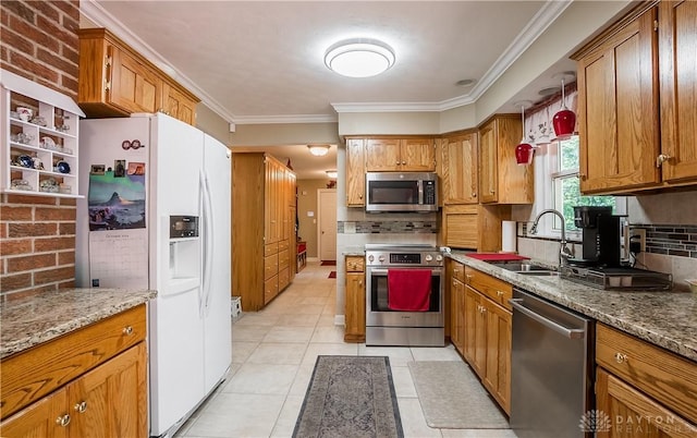 kitchen with tasteful backsplash, ornamental molding, appliances with stainless steel finishes, and sink