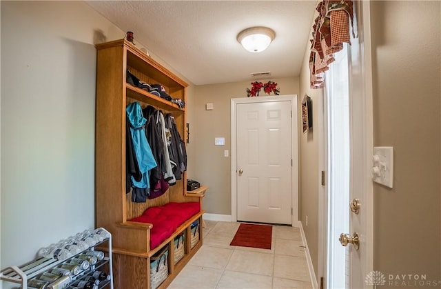 mudroom featuring light tile patterned floors