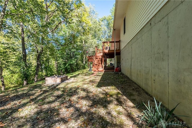 view of yard featuring a wooden deck