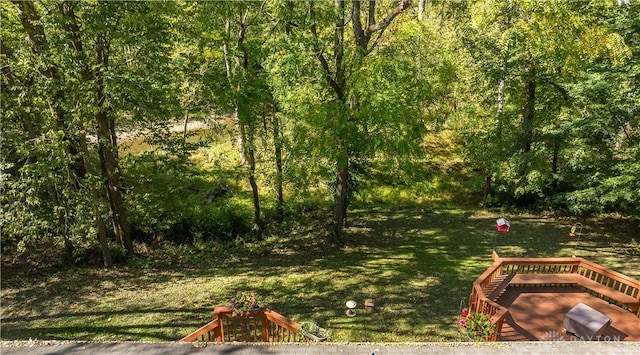 view of yard with a view of trees