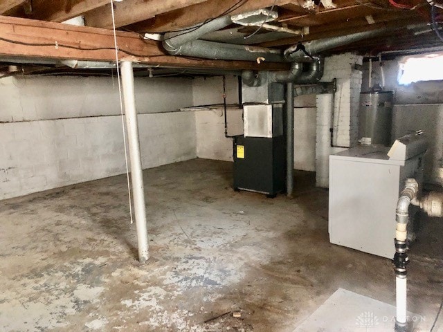 basement with gas water heater and heating unit