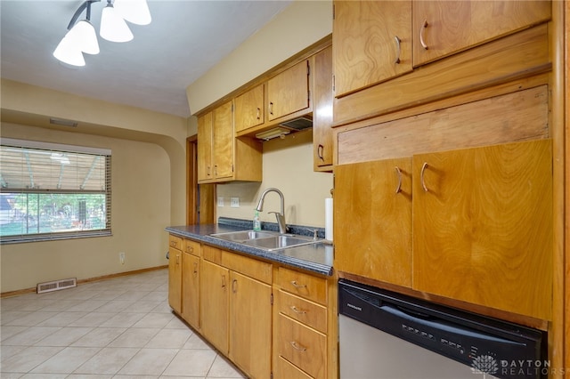 kitchen with sink, light tile patterned flooring, and stainless steel dishwasher