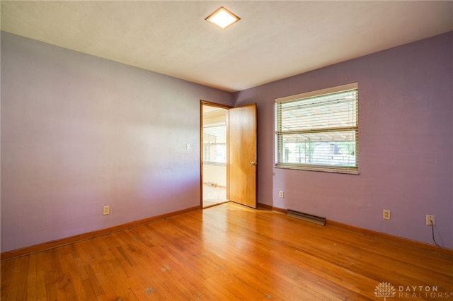 spare room featuring light hardwood / wood-style flooring