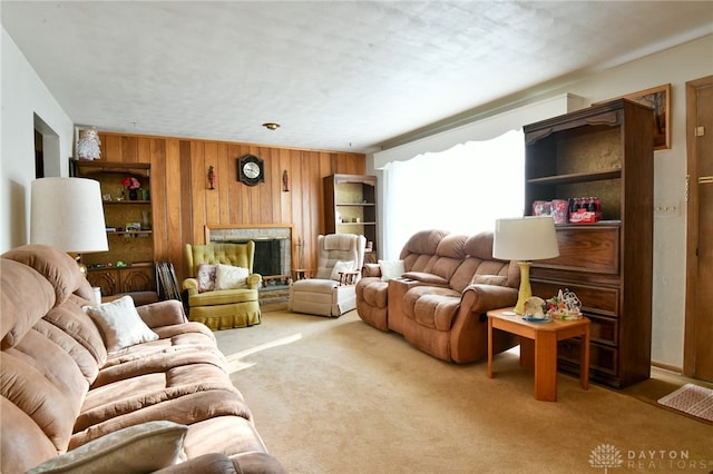 carpeted living room with wood walls