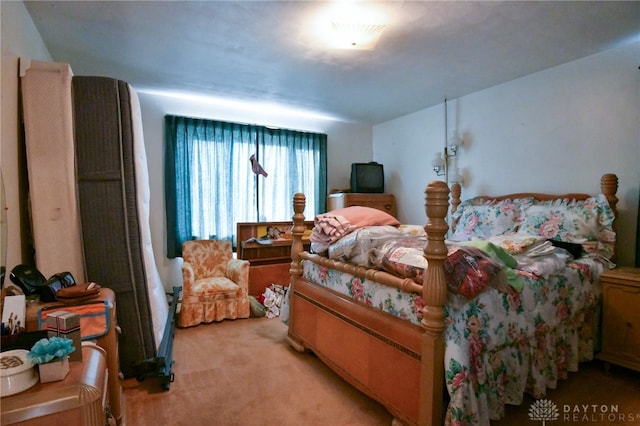 bedroom featuring light carpet