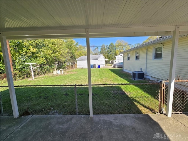 view of yard featuring fence, cooling unit, and a patio