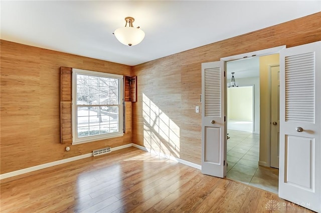 spare room featuring light wood-type flooring