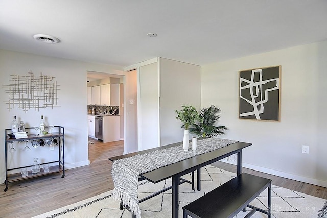 dining room with light hardwood / wood-style floors