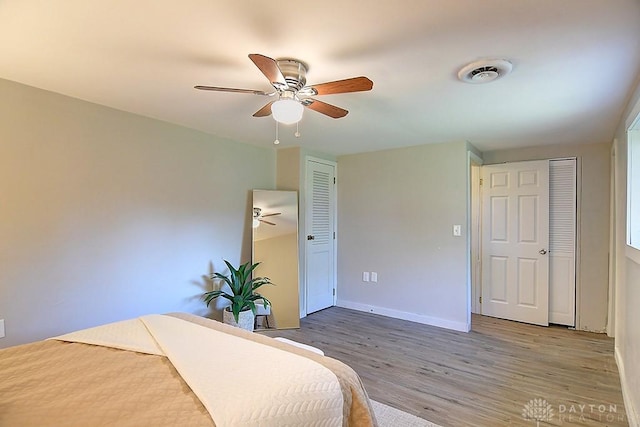 bedroom featuring ceiling fan and hardwood / wood-style flooring